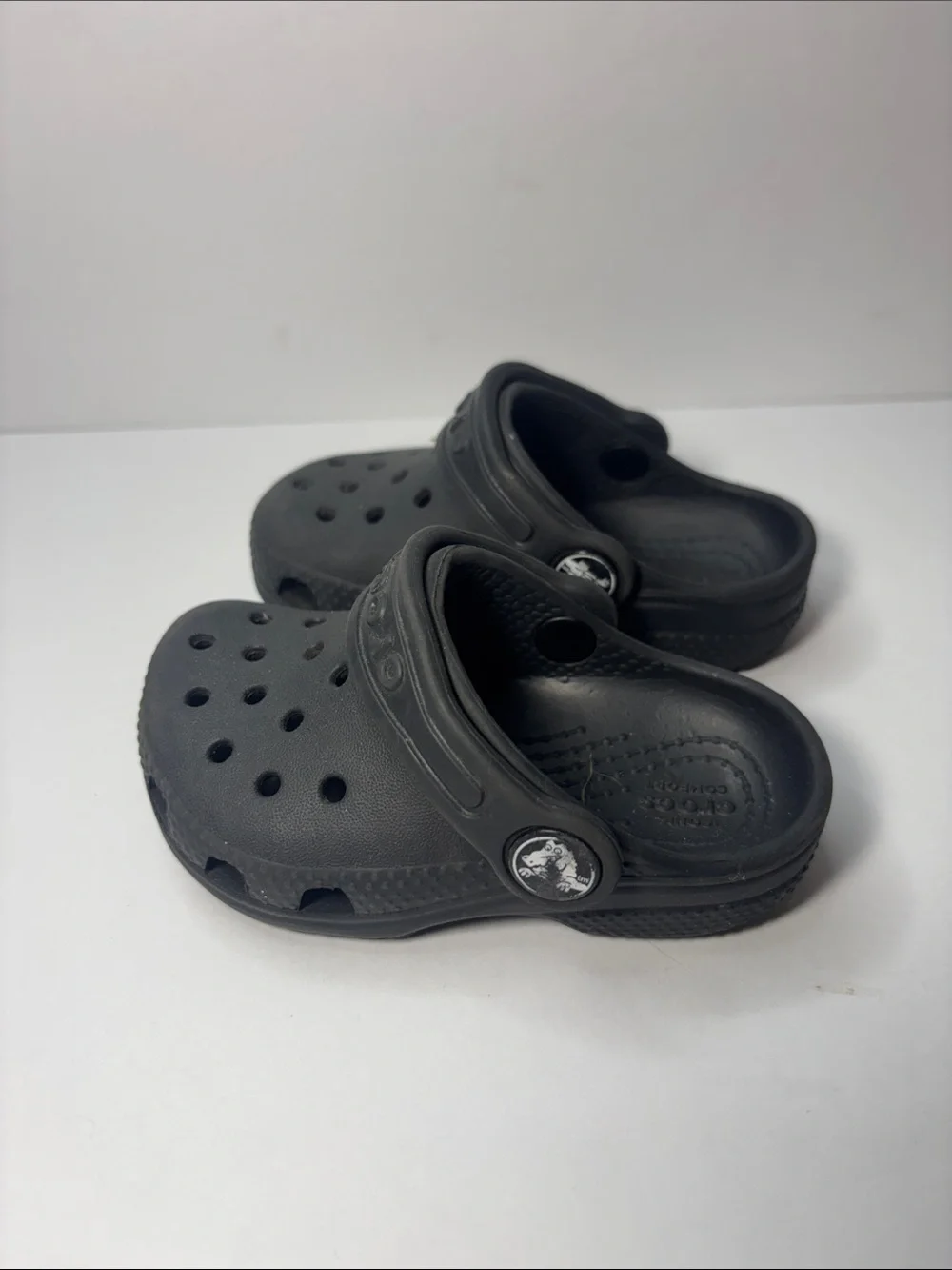 CROCS Kids Black Clogs with Orange Accent Charm